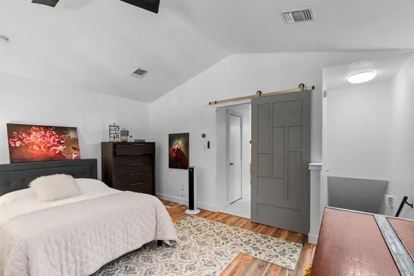 a bedroom with a bed and a walk in closet