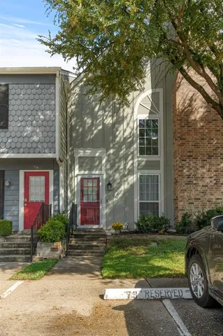a view of a patio with table and chairs with wooden fence