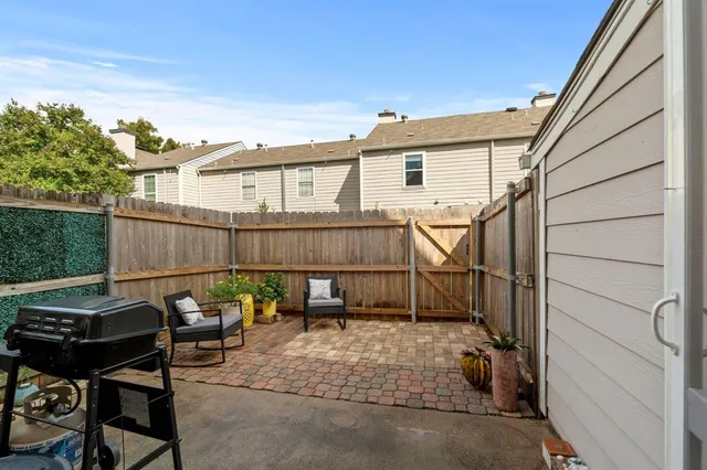 a view of a two chairs in the patio