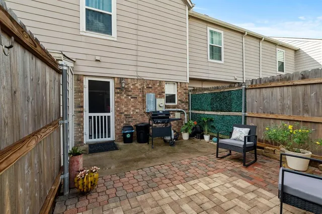 a backyard of a house with seating space