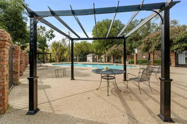 a view of a swimming pool with a patio