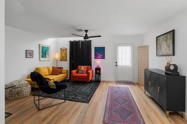 a bedroom with furniture and a rug