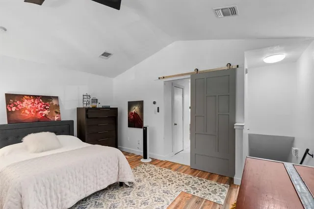 a bedroom with a bed and a walk in closet