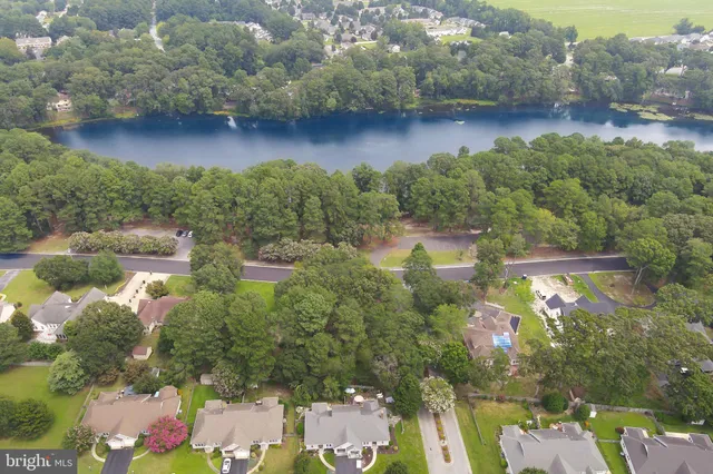 a view of bathroom with a large window and a white car