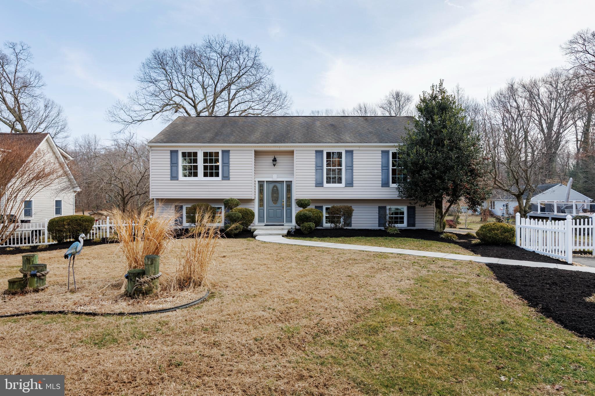 939 Shore Acres Road Arnold, MD 21012 - Photo 1 of 32 a front view of a house with a yard and garage