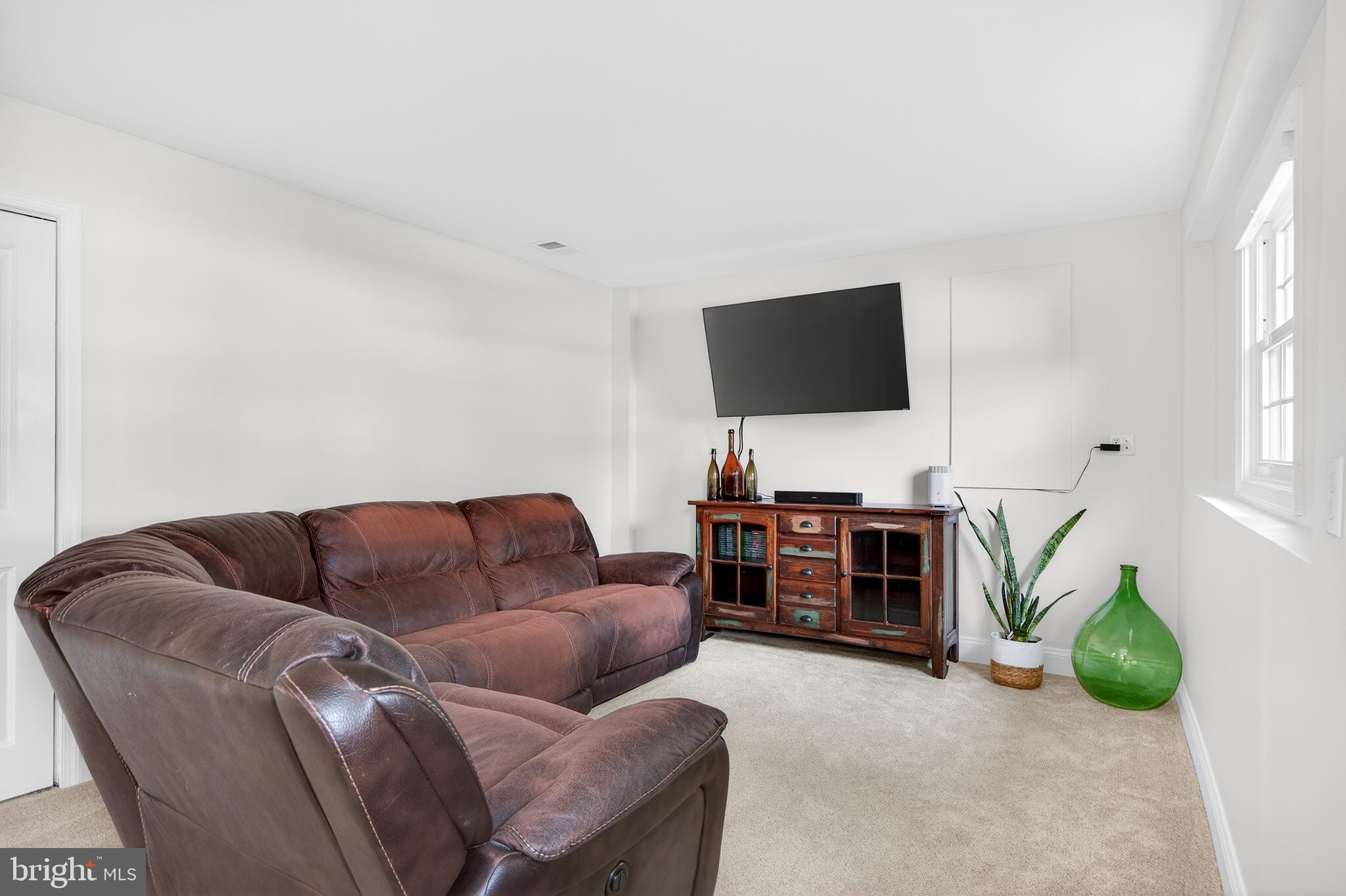 939 Shore Acres Road Arnold, MD 21012 - Photo 15 of 32 a living room with furniture and a flat screen tv
