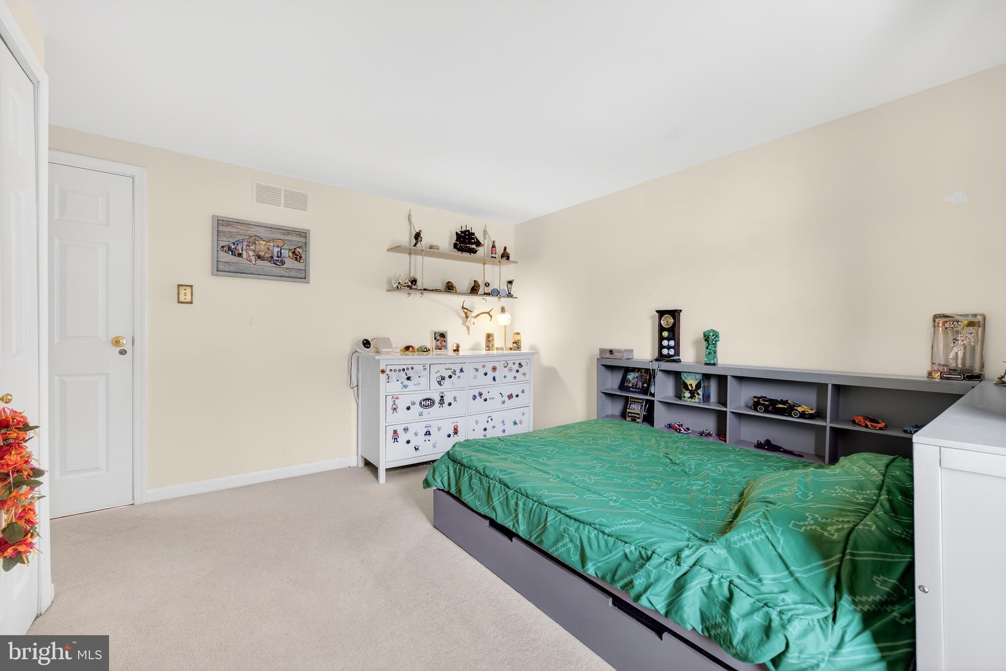 939 Shore Acres Road Arnold, MD 21012 - Photo 10 of 32 a view of a bedroom with baby bed and toys