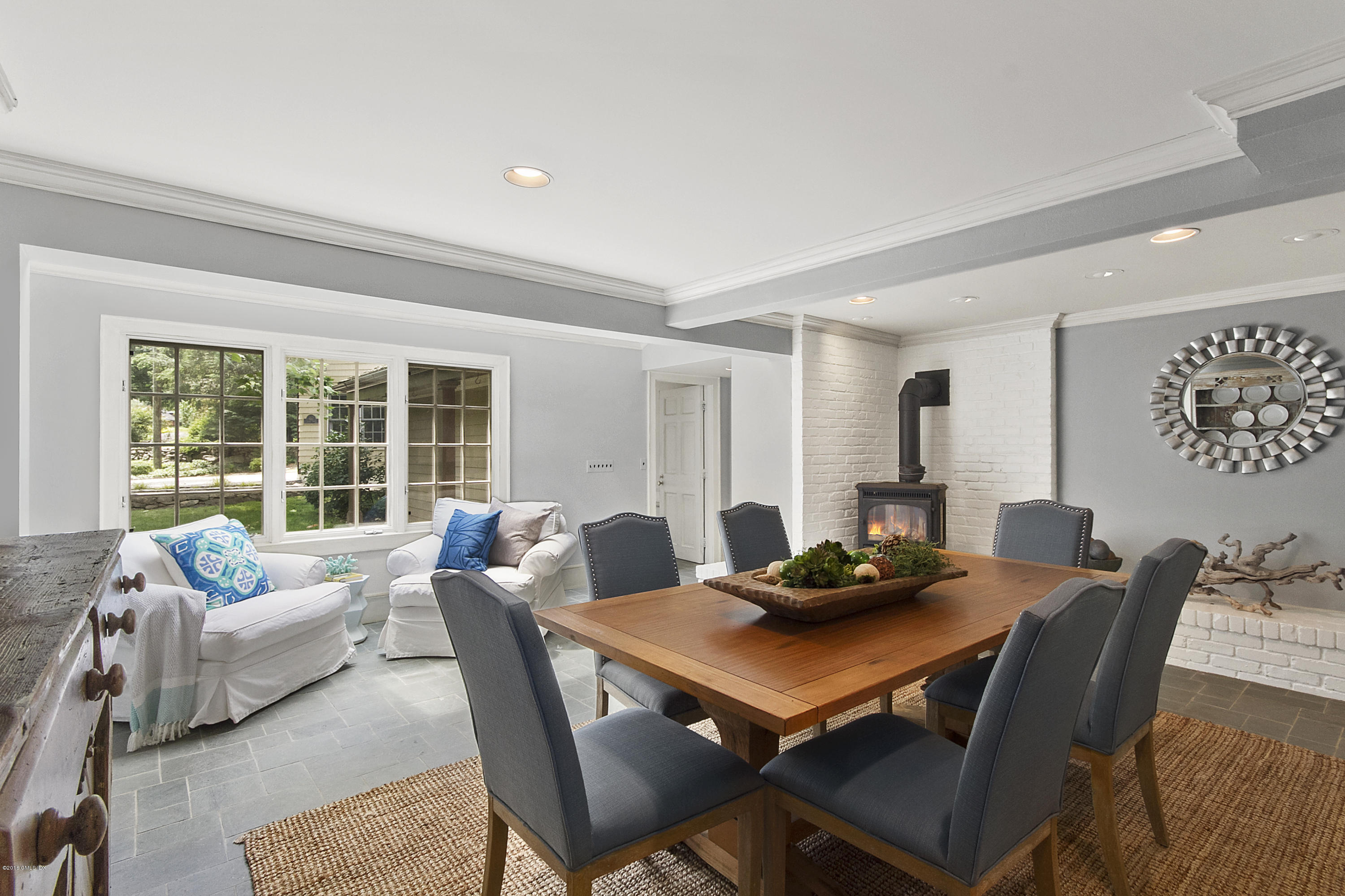467 Laurel Road New Canaan, CT 06840 - Photo 11 of 29 a view of a dining room with furniture and a large window