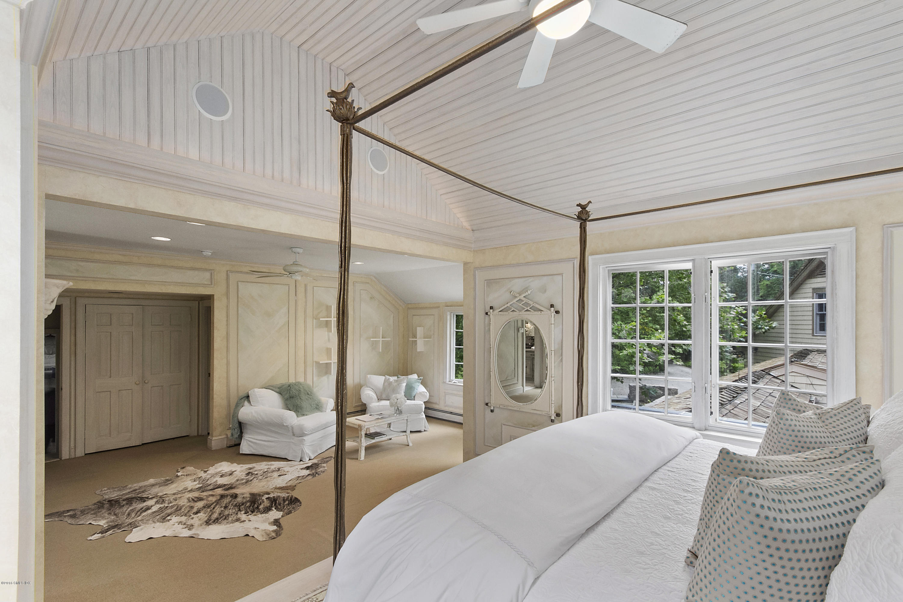 467 Laurel Road New Canaan, CT 06840 - Photo 13 of 29 a spacious bedroom with a large bed and a large window