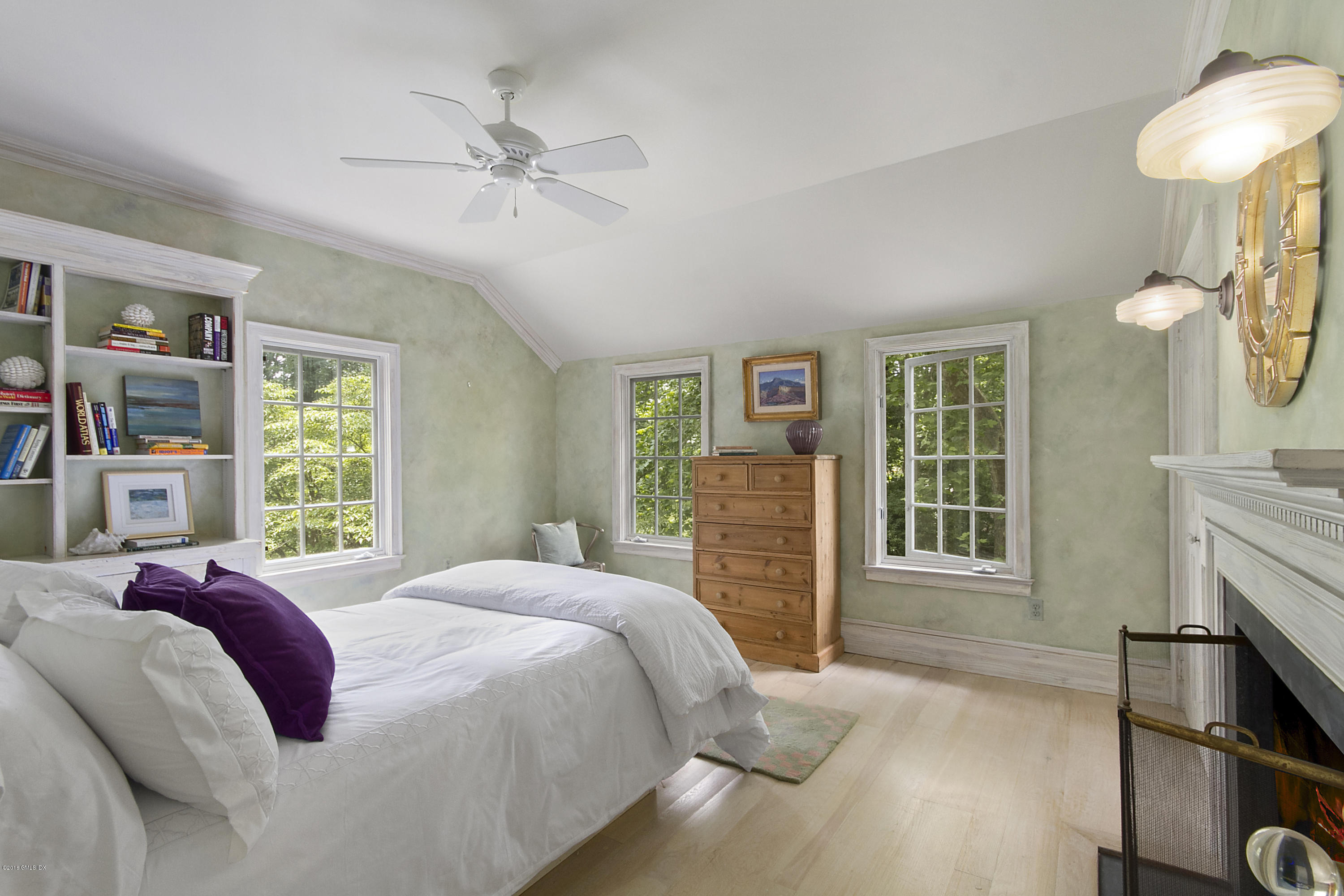 467 Laurel Road New Canaan, CT 06840 - Photo 17 of 29 a spacious bedroom with a bed dresser and a window