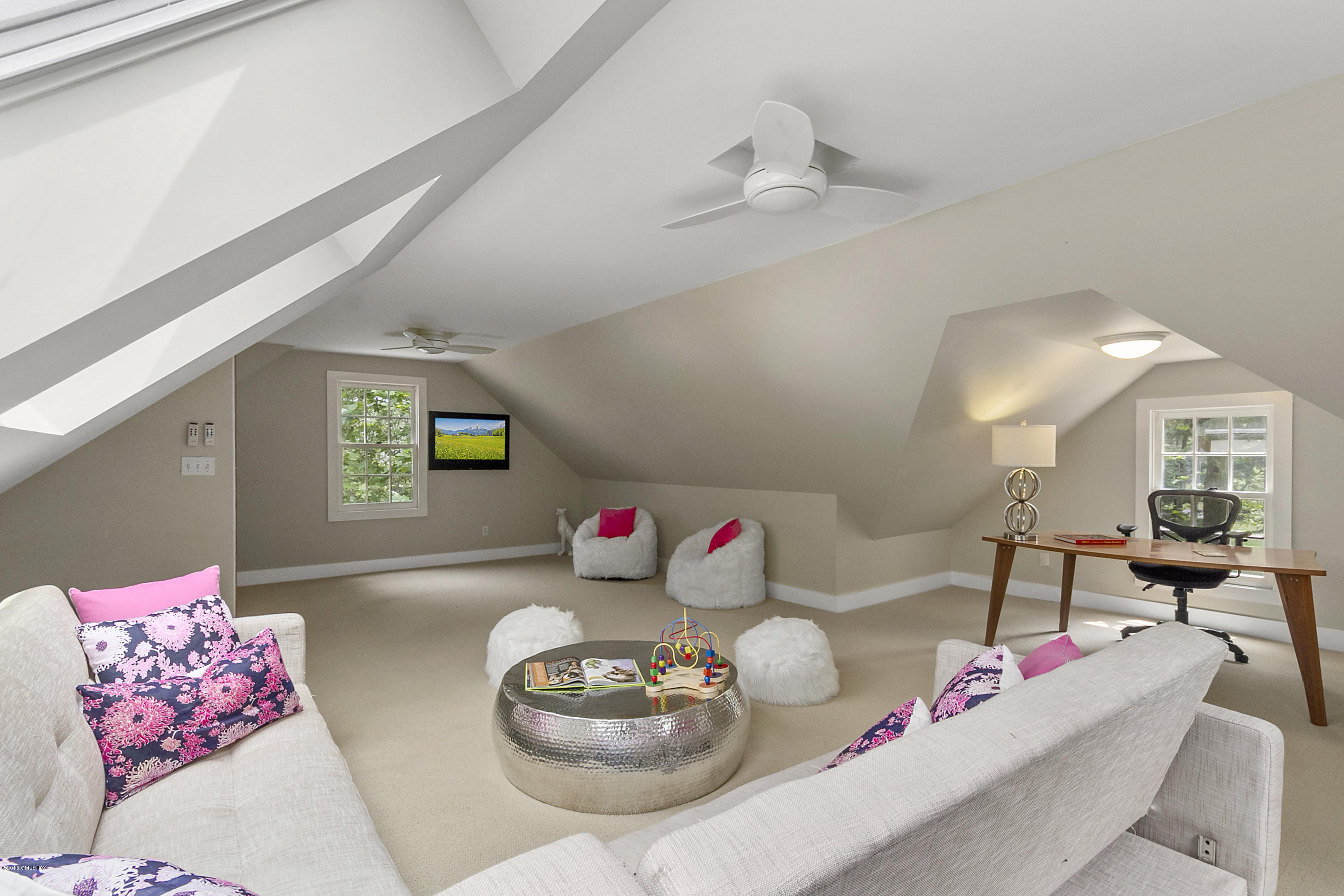 467 Laurel Road New Canaan, CT 06840 - Photo 20 of 29 a living room with furniture and flowers