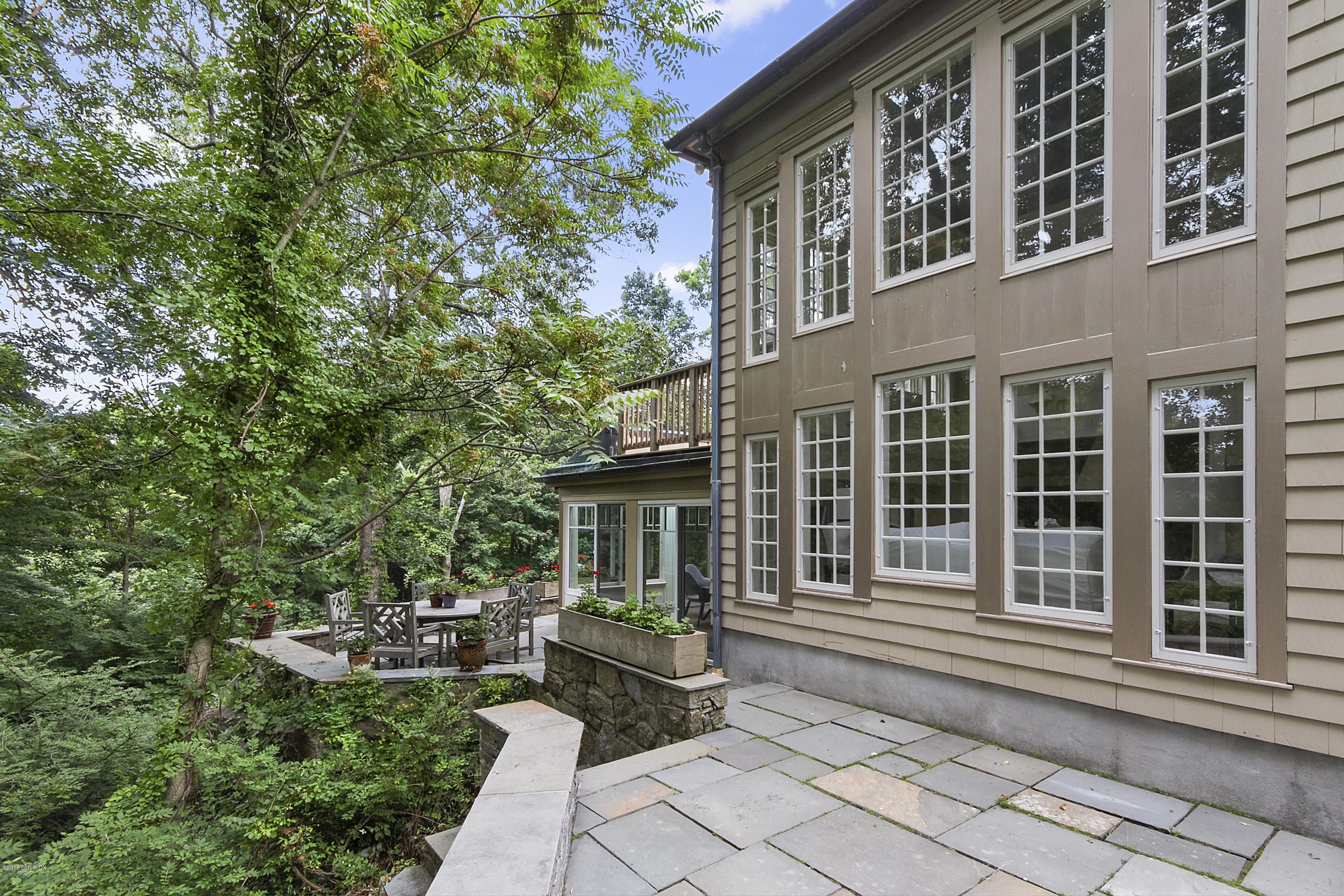 467 Laurel Road New Canaan, CT 06840 - Photo 21 of 29 front view of a house with a porch