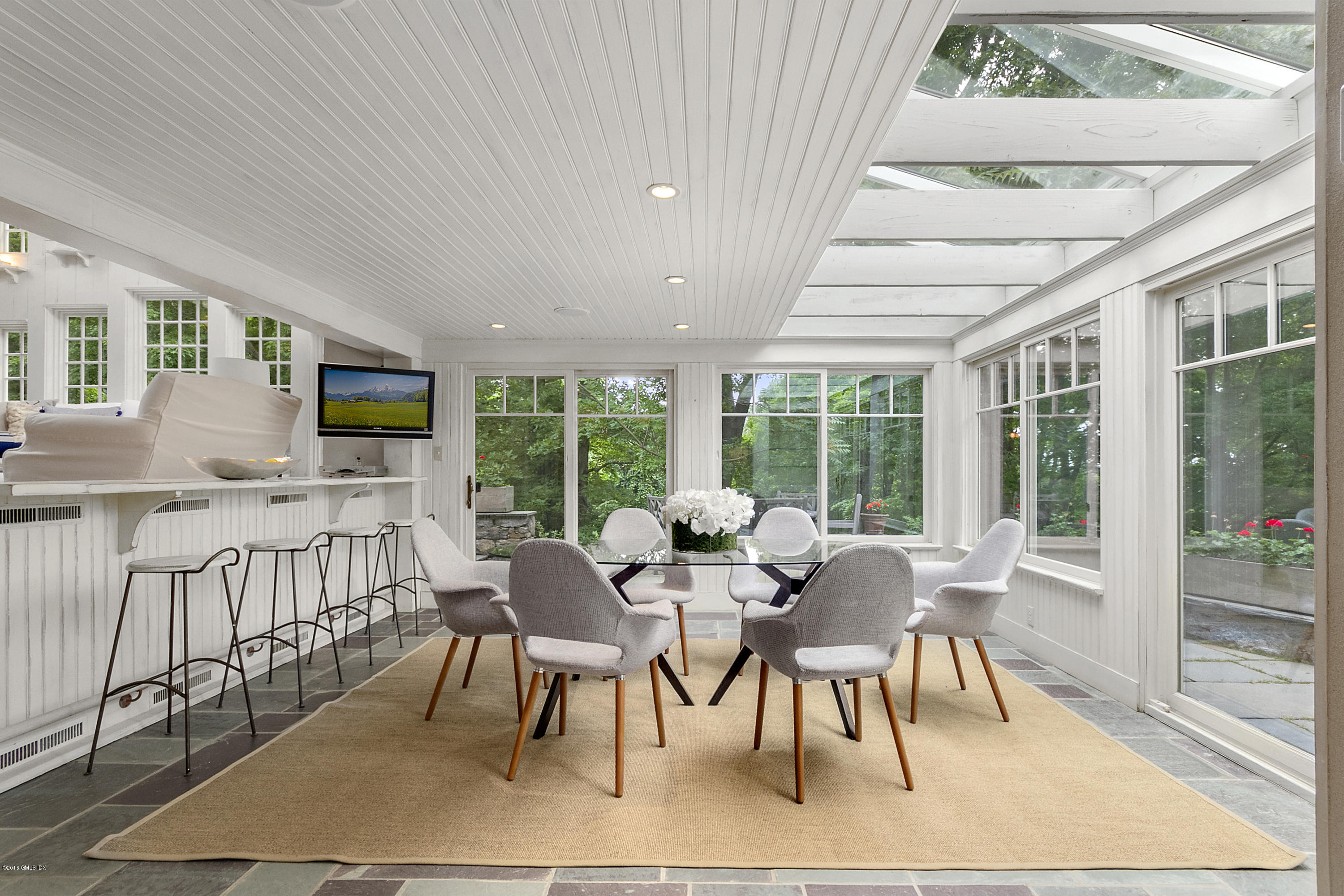 467 Laurel Road New Canaan, CT 06840 - Photo 6 of 29 a view of a dining room with furniture window and outside view