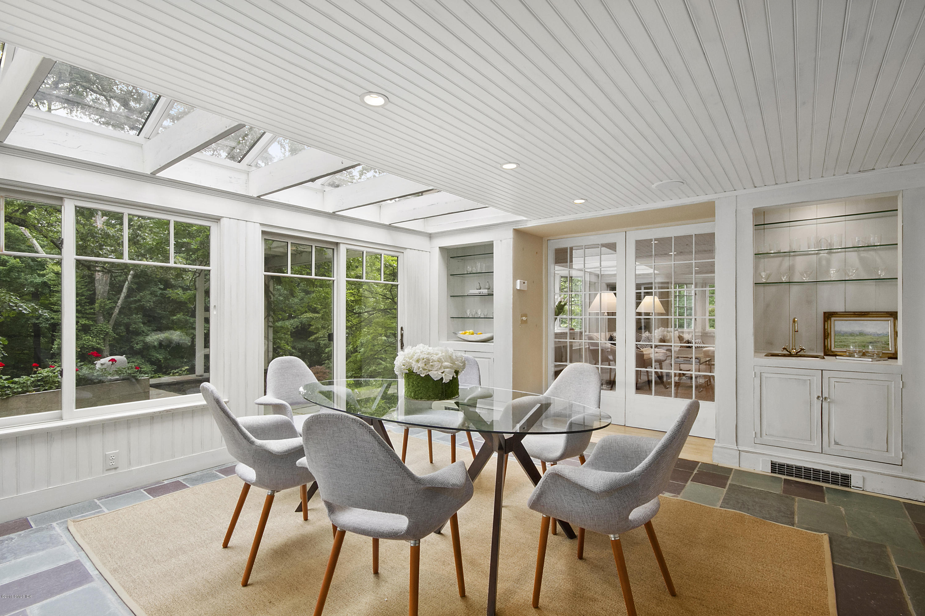 467 Laurel Road New Canaan, CT 06840 - Photo 7 of 29 a dining room with furniture and wooden floor