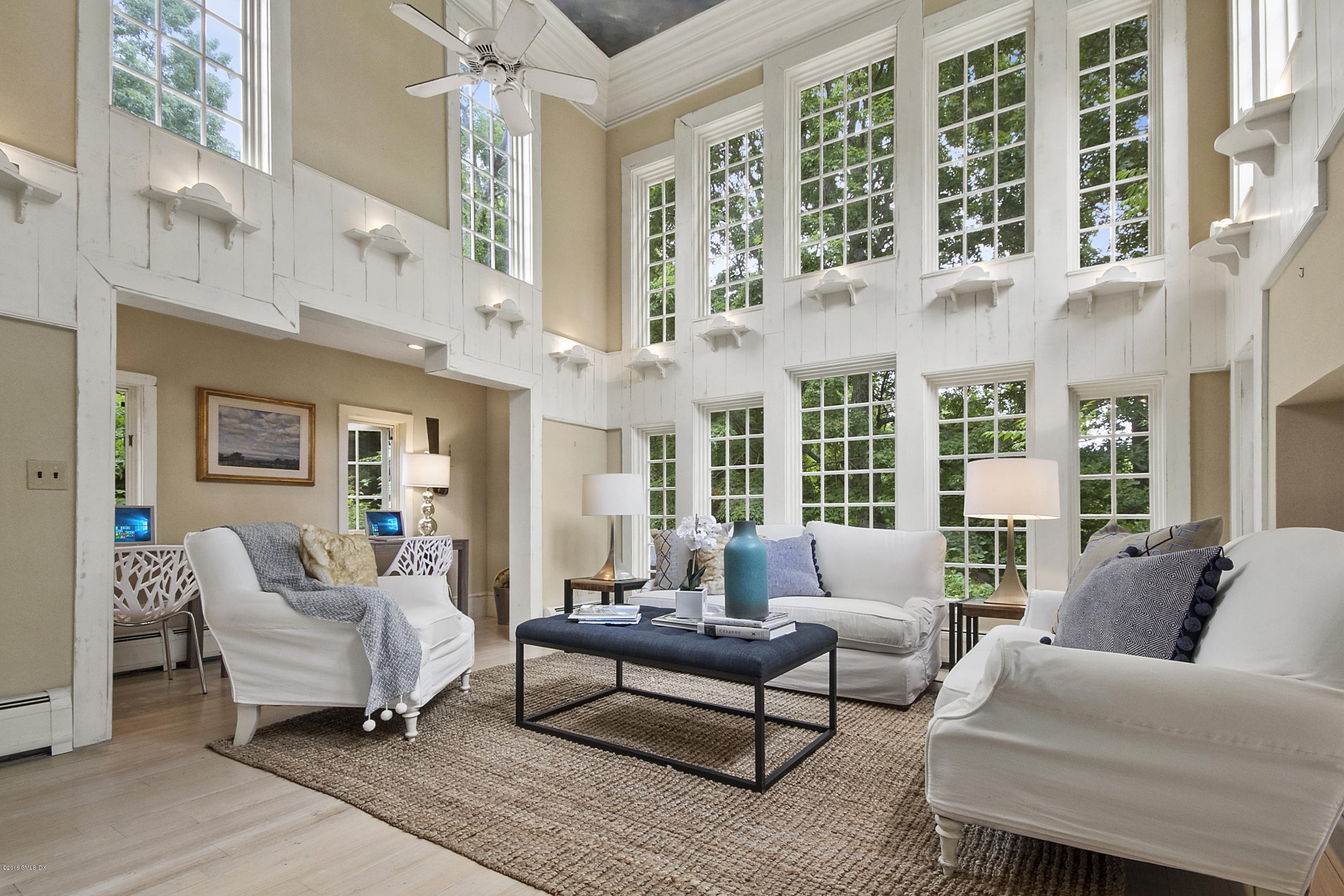 467 Laurel Road New Canaan, CT 06840 - Photo 9 of 29 a living room with furniture and floor to ceiling windows