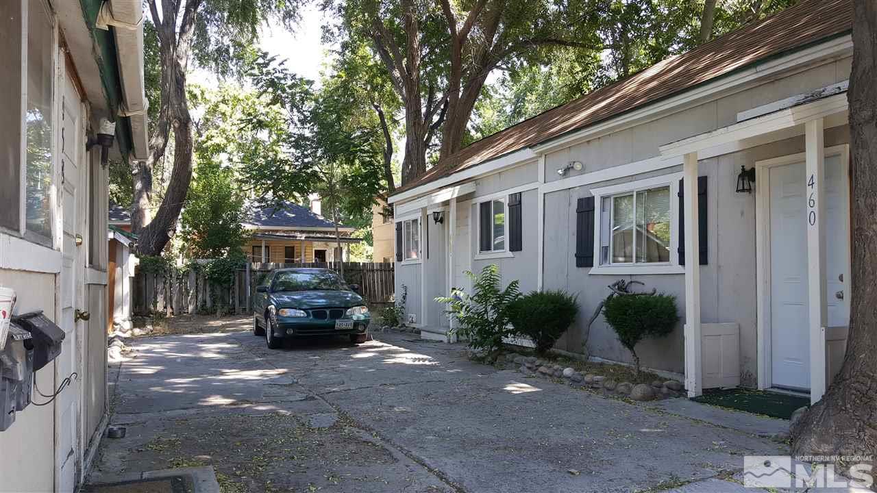 458 East 7th Street Reno, NV 89512 - Photo 2 of 2 a car parked in front of a brick house with a large tree