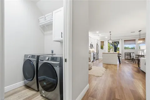 a view of a hallway with washer and dryer
