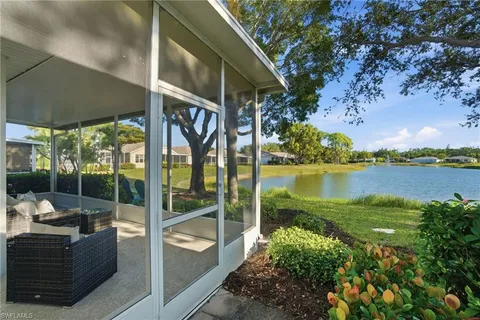 a view of a couches in patio of a lake view