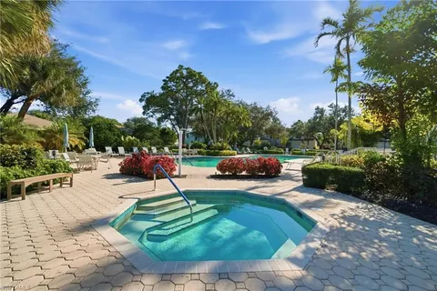 a view of a backyard with sitting area