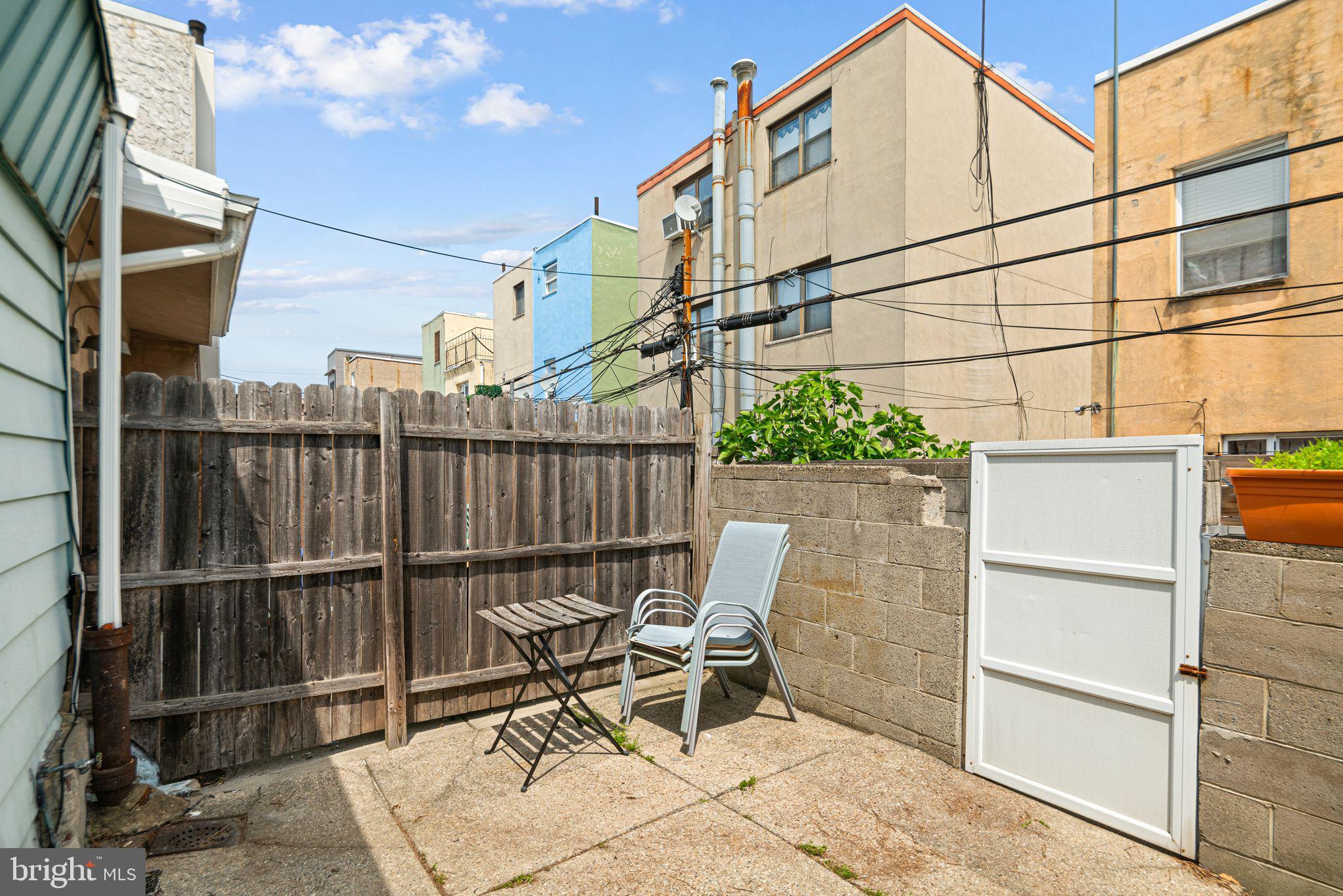 1925 South Alder Street Philadelphia, PA 19148 - Photo 13 of 13 a chair and table in a backyard
