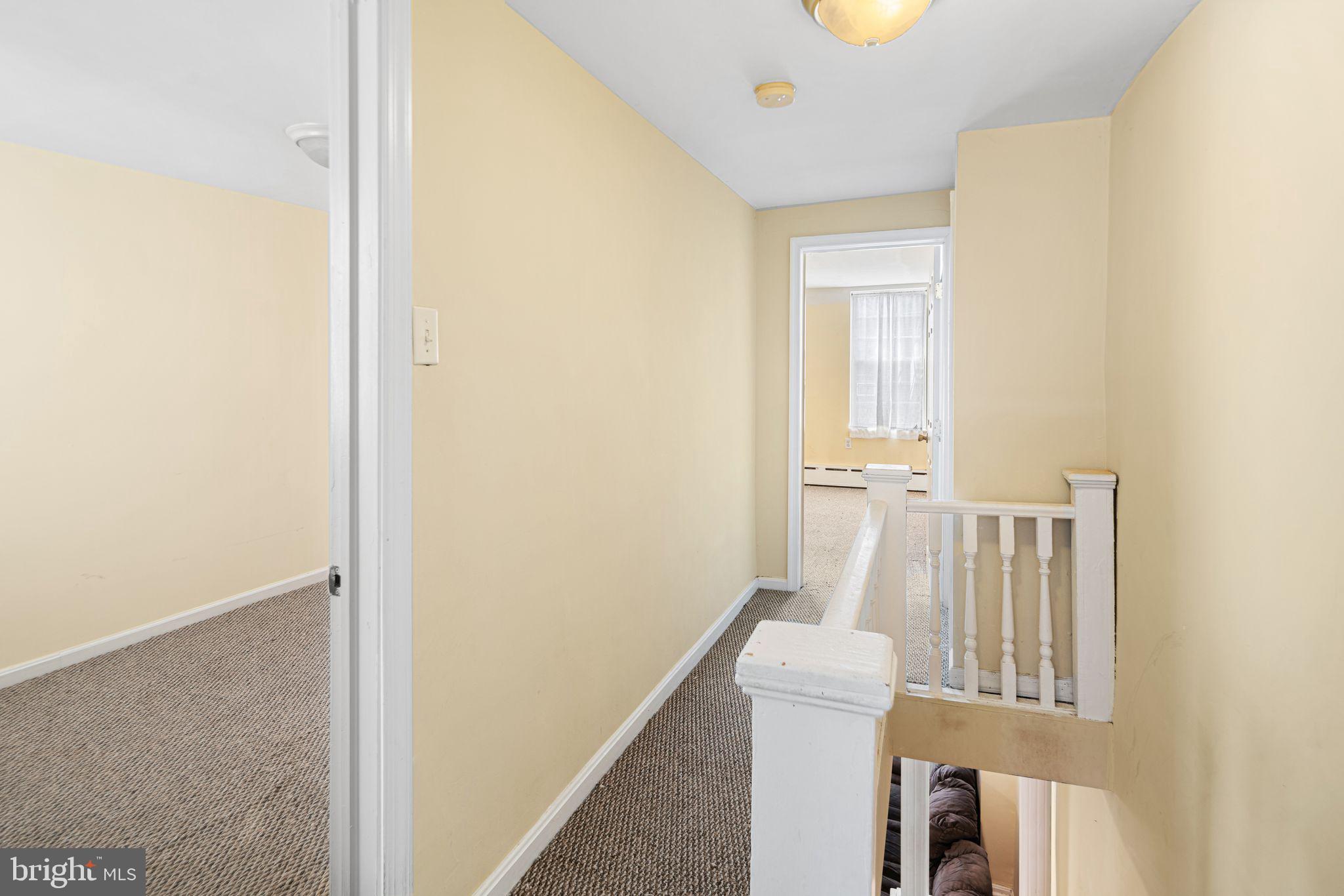 1925 South Alder Street Philadelphia, PA 19148 - Photo 5 of 13 a view of a hallway with furniture and wooden floor