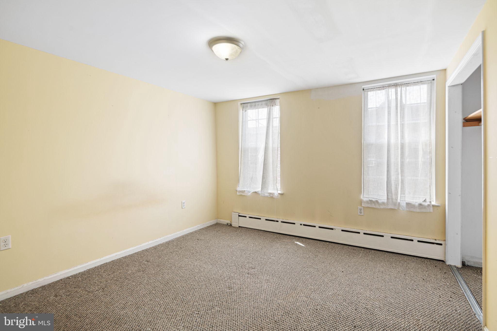 1925 South Alder Street Philadelphia, PA 19148 - Photo 7 of 13 an empty room with a empty space and windows