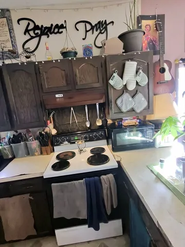 a kitchen with a table and chairs