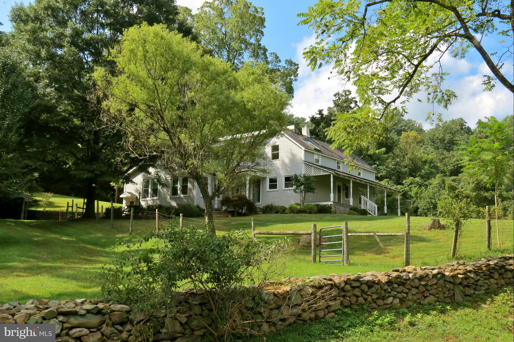 324 Riley Hollow Road Huntly, VA 22640 - Photo 1 of 24 Front of the house and stone wall
