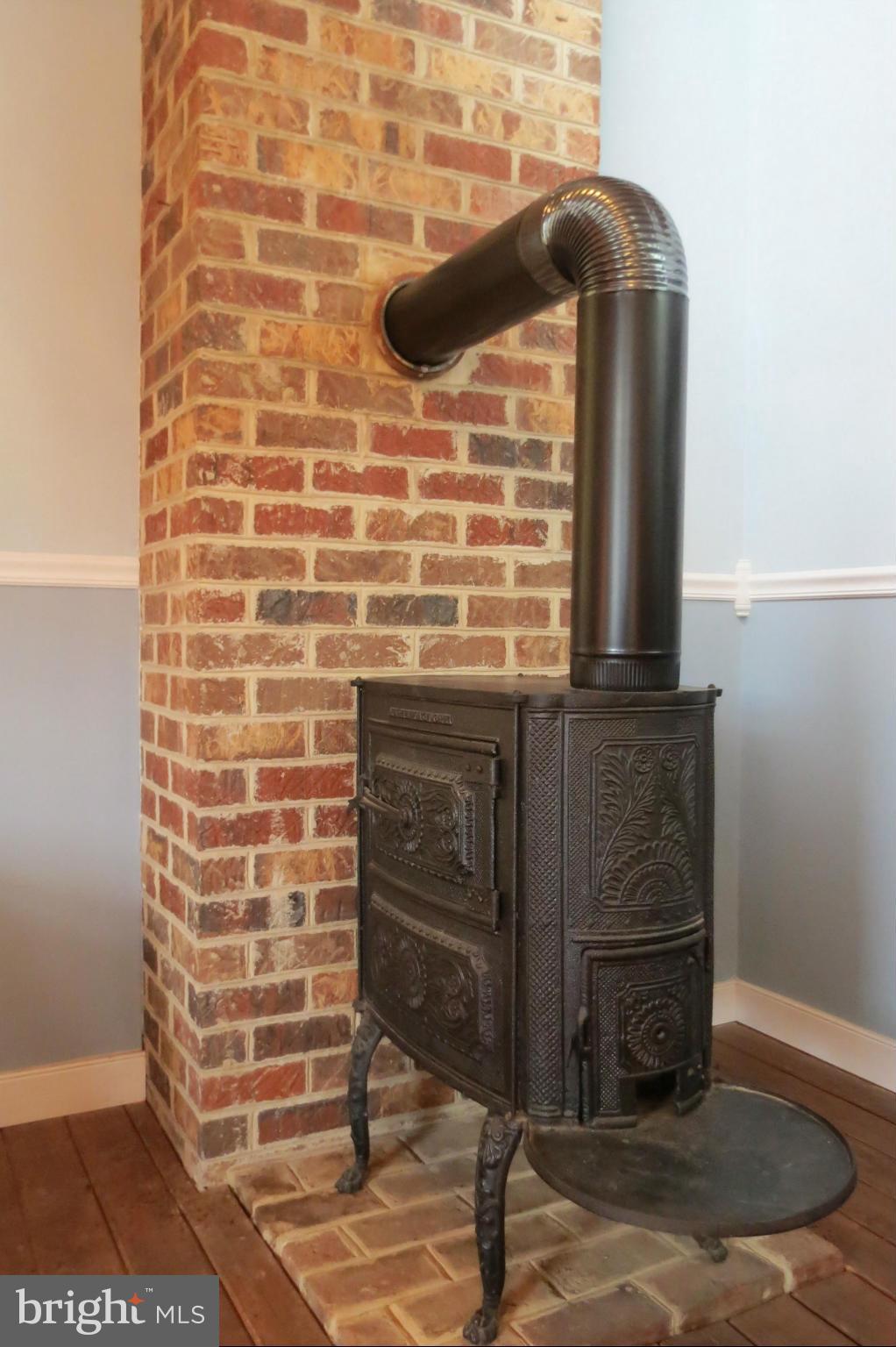 324 Riley Hollow Road Huntly, VA 22640 - Photo 15 of 24 Wood stove in the bedroom