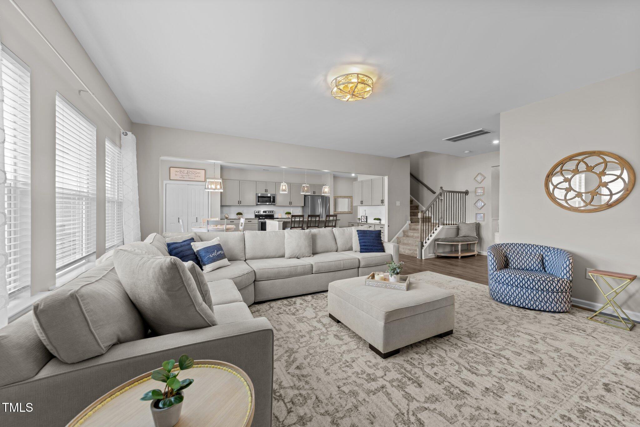 3613 Cross Timber Lane Raleigh, NC 27603 - Photo 11 of 33 a living room with furniture and a large window