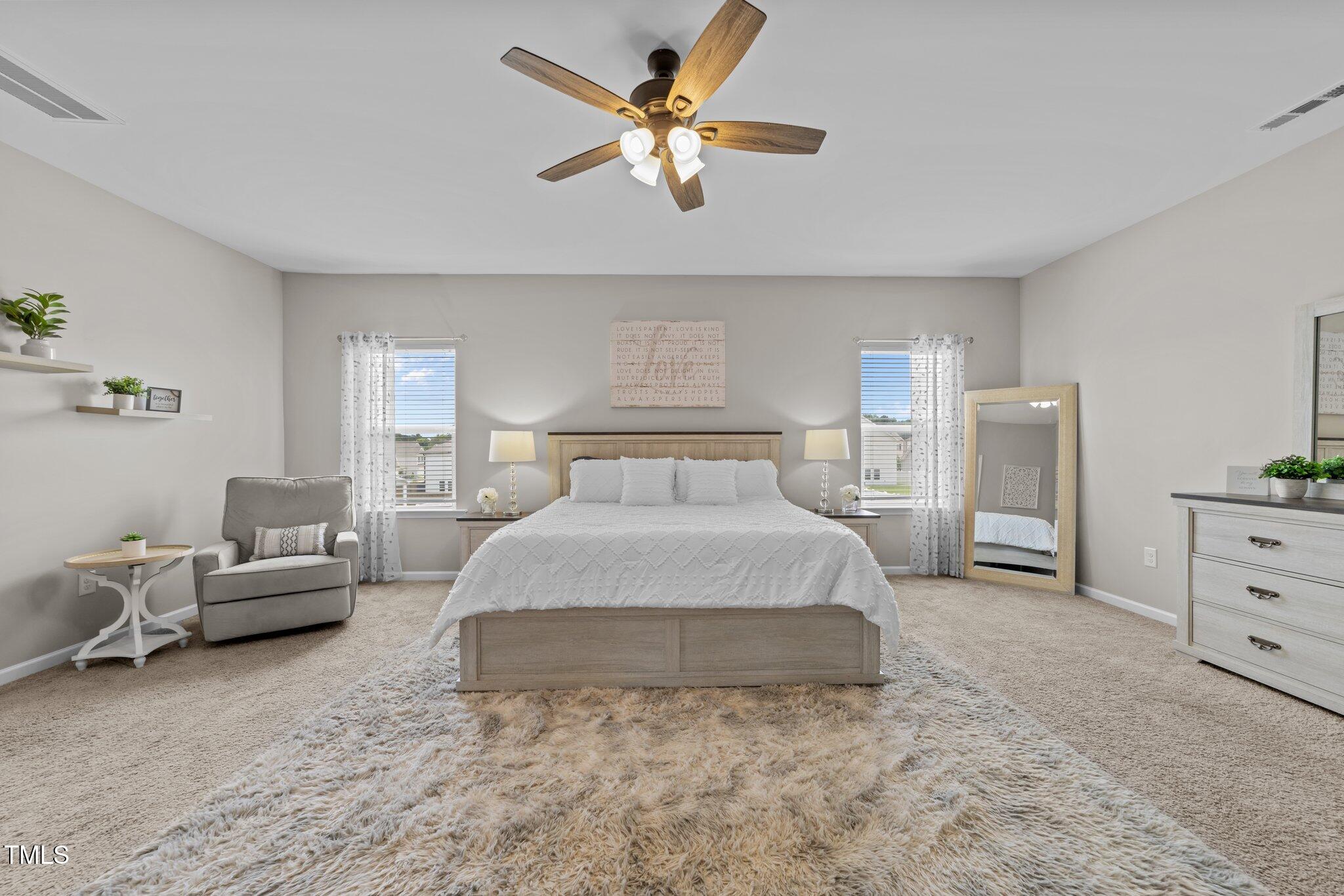 3613 Cross Timber Lane Raleigh, NC 27603 - Photo 21 of 33 a spacious bedroom with a bed and furniture