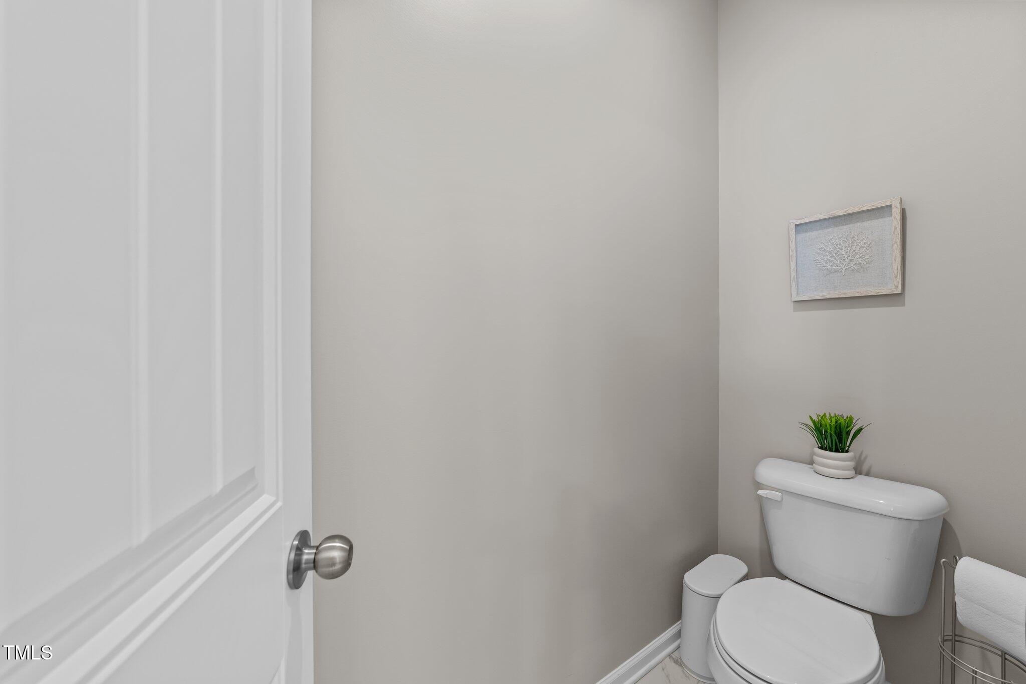 3613 Cross Timber Lane Raleigh, NC 27603 - Photo 25 of 33 a white toilet sitting next to a shower