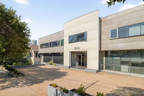 a view of a building with a street