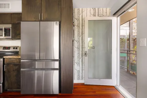 a bedroom with a large bed and a dresser