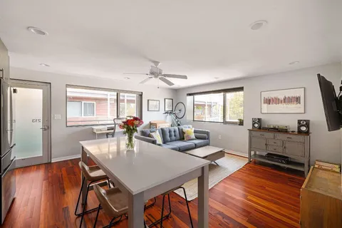 a view of a potted flower in the corridor