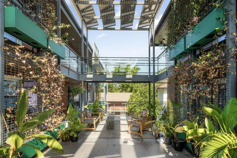 a bedroom with a bed closet and a window