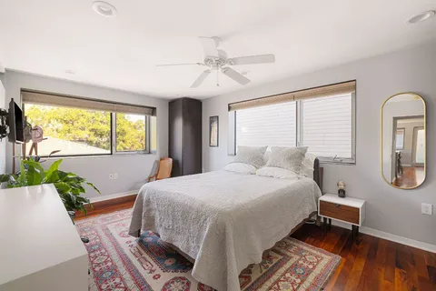 a kitchen with stainless steel appliances granite countertop a sink refrigerator and cabinets
