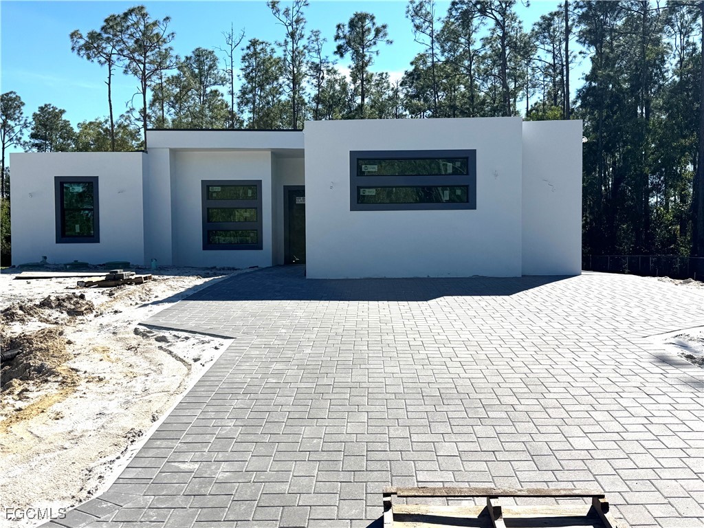 3306 East 2nd Street Lehigh Acres, FL 33936 - Photo 2 of 7 a backyard of a house