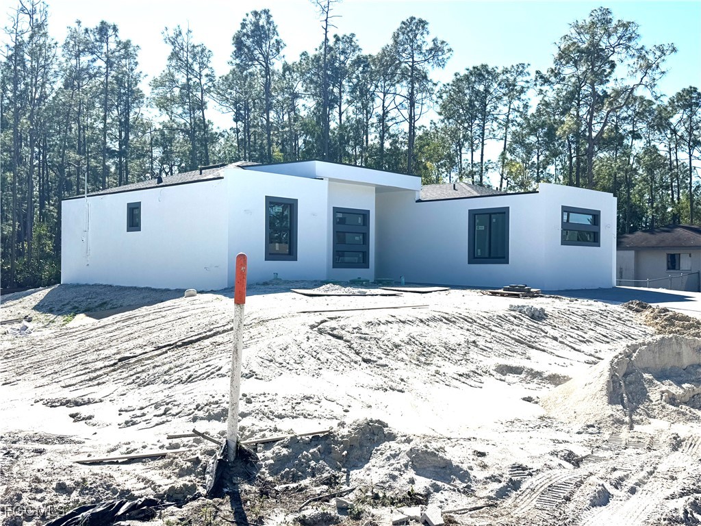 3306 East 2nd Street Lehigh Acres, FL 33936 - Photo 4 of 7 a view of a backyard of the house