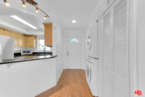 a view of a kitchen from the hallway