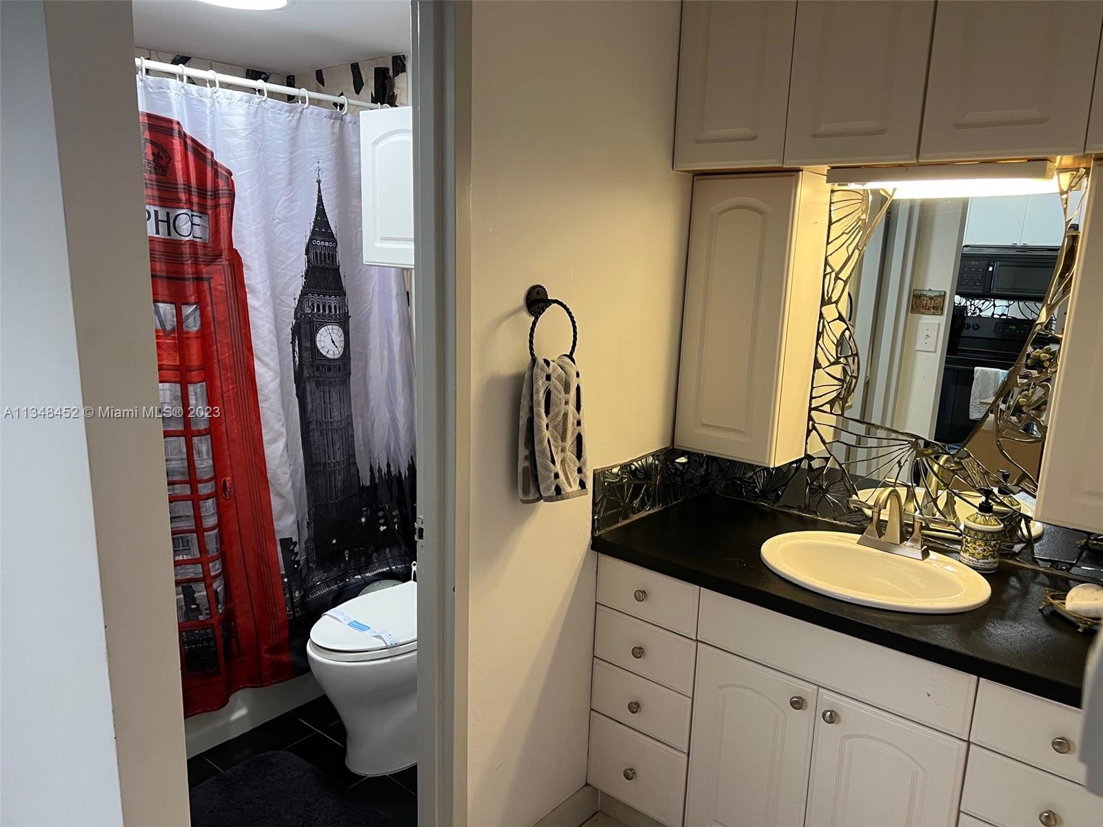 100 Lincoln Road, Unit 1007 Miami Beach, FL 33139 - Photo 26 of 80 a bathroom with a sink toilet and shower