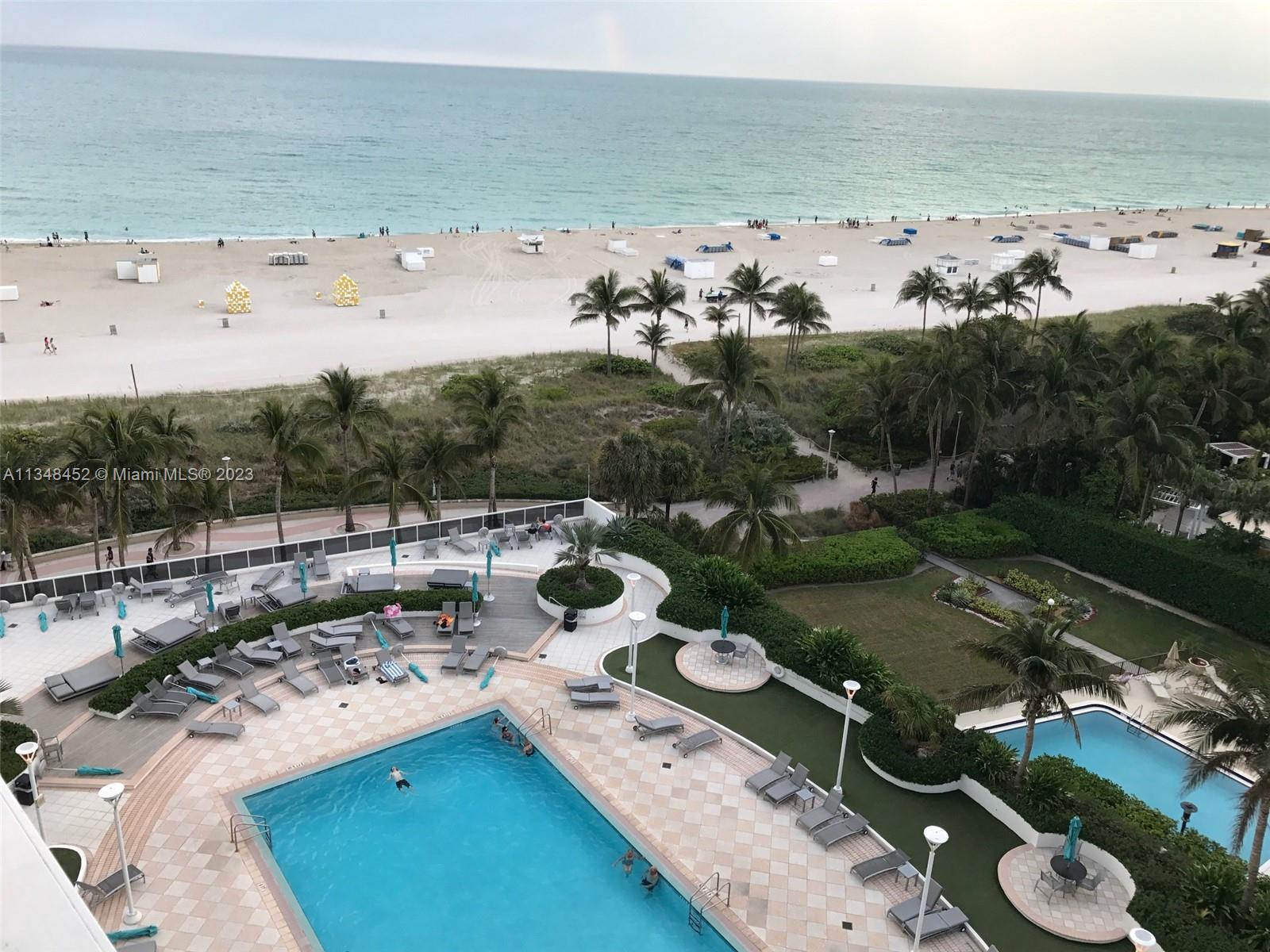 100 Lincoln Road, Unit 1007 Miami Beach, FL 33139 - Photo 41 of 80 an aerial view of a house with lots of residential buildings ocean and mountain in back