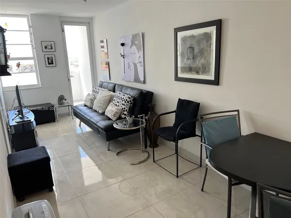 a view of a livingroom with furniture and a couch