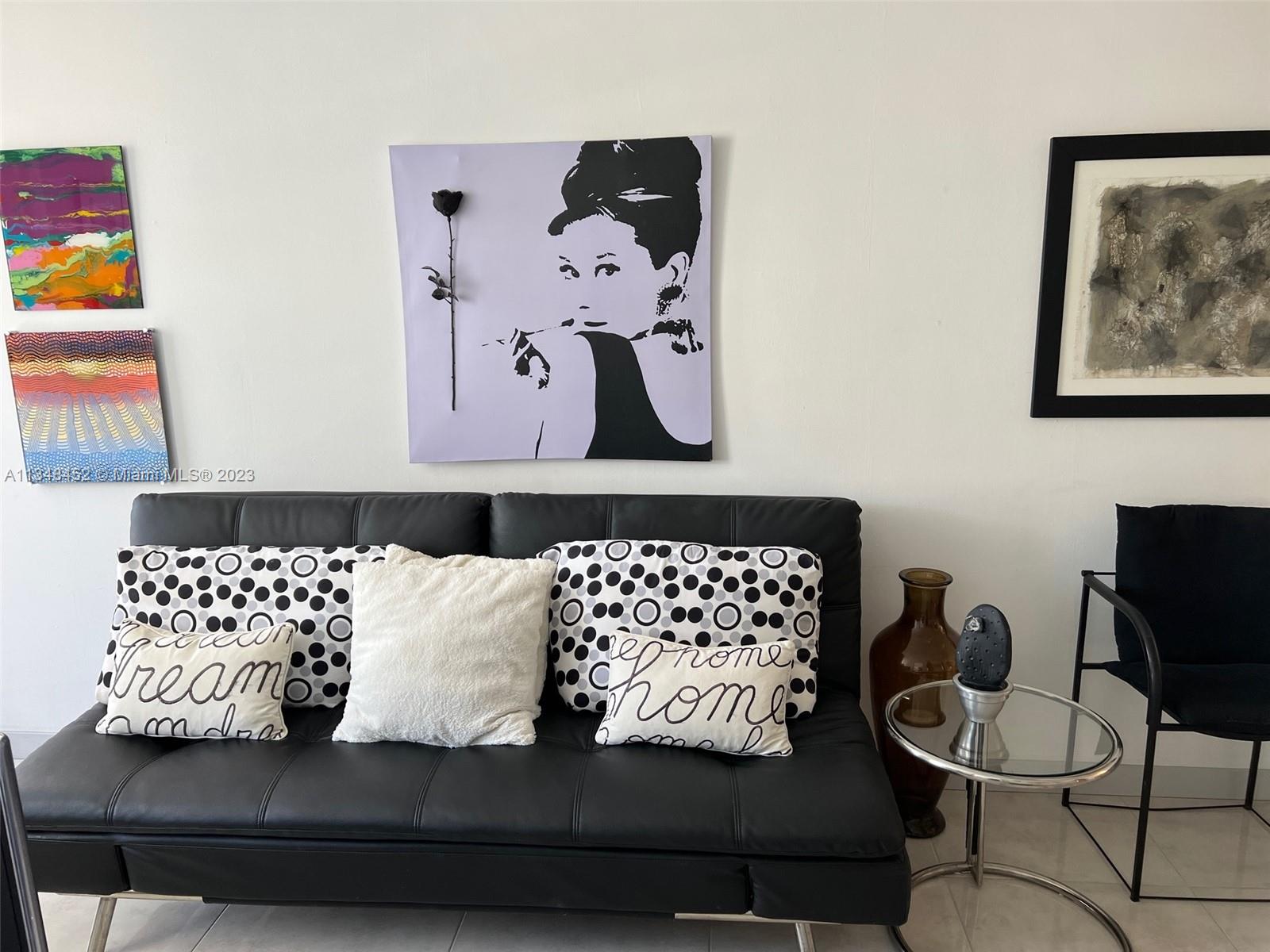 100 Lincoln Road, Unit 1007 Miami Beach, FL 33139 - Photo 6 of 80 a living room with furniture and painting on the wall