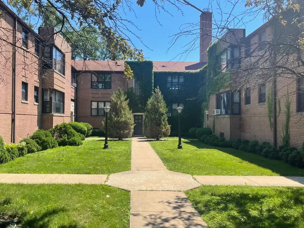 a view of a building with a yard