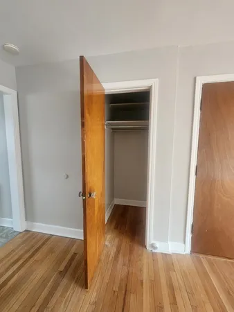 a view of hallway with wooden floor