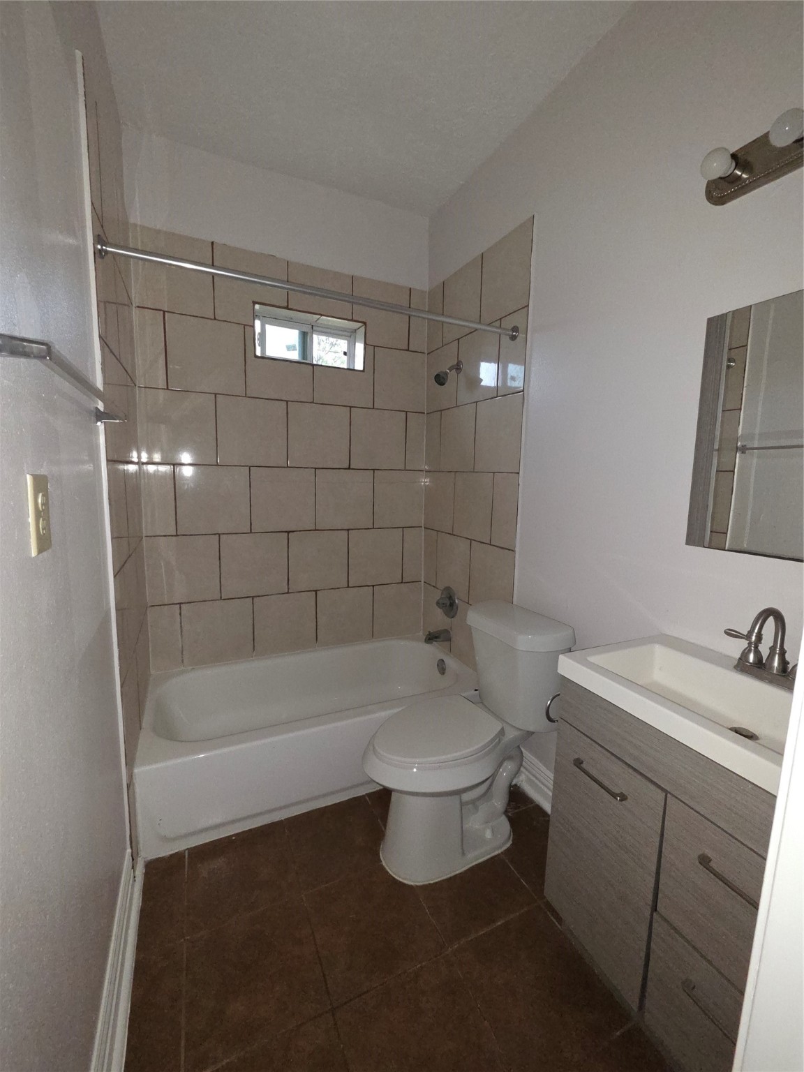 7902 Hudson Street, Unit A Houston, TX 77012 - Photo 2 of 8 a bathroom with a sink a toilet and shower