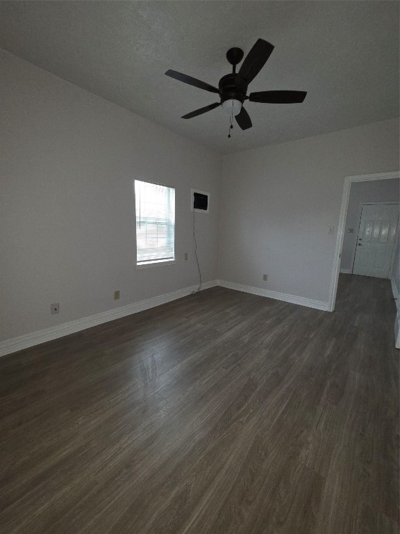 7902 Hudson Street, Unit A Houston, TX 77012 - Photo 3 of 8 an empty room with wooden floor and windows