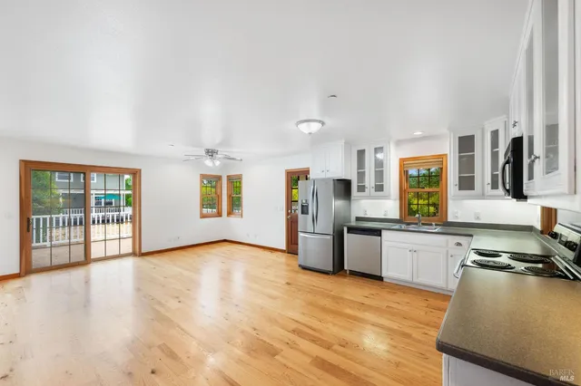 a view of kitchen with wooden floor