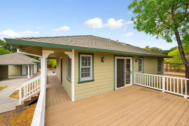 a view of a house with a yard and garage